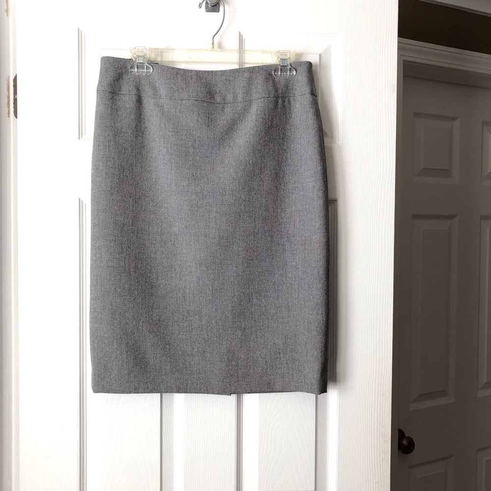 Grey knee length skirt.